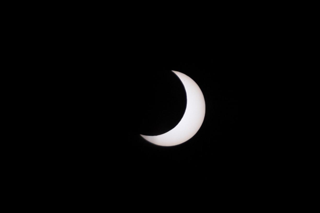 The moon crosses in front of the sun during the annular solar eclipse, as seen from the Mexico Monument in Tijuana, Baja California State, Mexico, on October 14, 2023.
Guillermo Arias / AFP