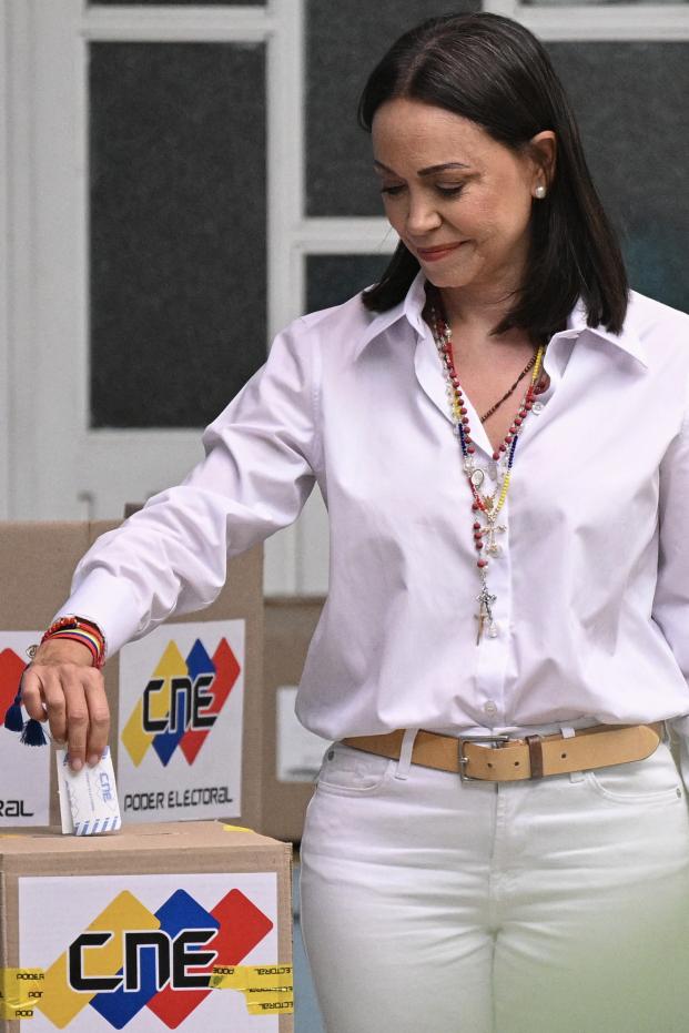 Venezuelan opposition leader Maria Corina Machado casts her vote during the presidential election, in Caracas on July 28, 2024. Venezuelans vote Sunday between continuity in President Nicolas Maduro or change in rival Edmundo Gonzalez Urrutia amid high tension following the incumbent's threat of a 