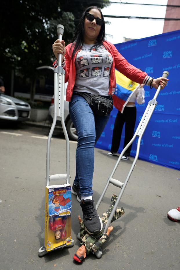 A Venezuelan living in Mexico poses for a picture while gathering outside the Venezuelan embassy in Mexico City, on July 28, 2024, during election day in their country. Venezuelans vote Sunday between continuity in President Nicolas Maduro or change in rival Edmundo Gonzalez Urrutia amid high tension following the incumbent's threat of a 