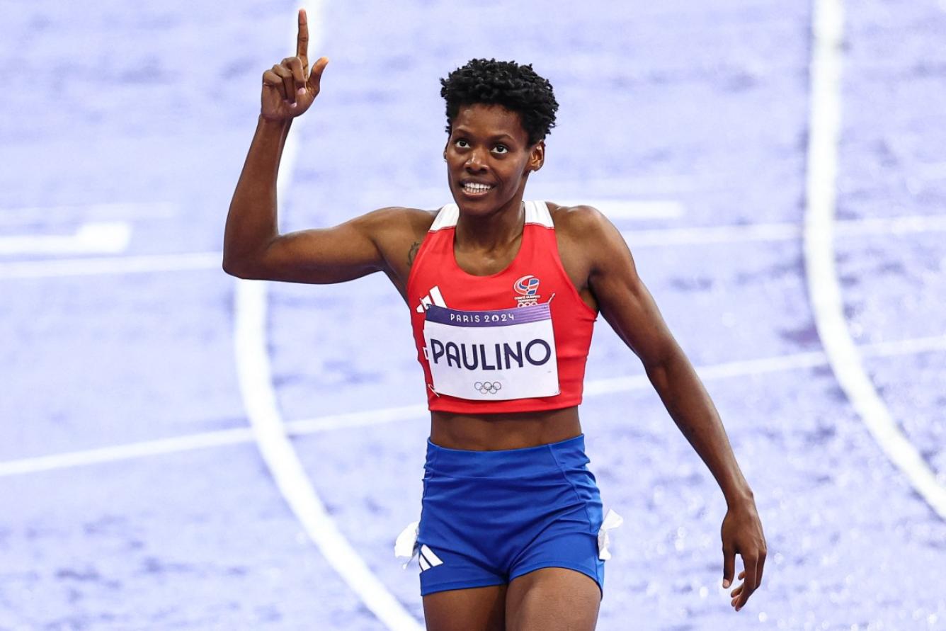 Dominican Republic's Marileidy Paulino celebrates after winning the women's 400m final of the athletics event at the Paris 2024 Olympic Games at Stade de France in Saint-Denis, north of Paris, on August 9, 2024. (Photo by Anne-Christine POUJOULAT / AFP)