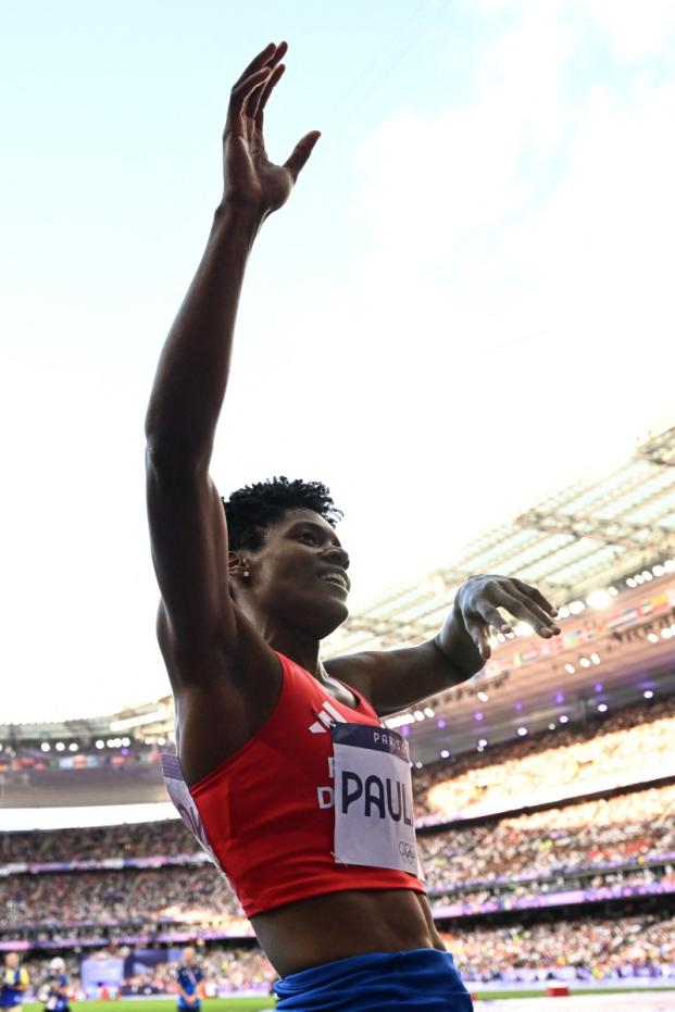 Dominican Republic's Marileidy Paulino celebrates after winning the women's 400m final of the athletics event at the Paris 2024 Olympic Games at Stade de France in Saint-Denis, north of Paris, on August 9, 2024. (Photo by MARTIN BERNETTI / AFP)