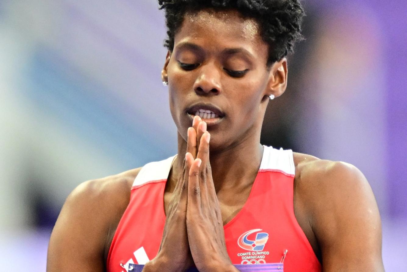 Dominican Republic's Marileidy Paulino celebrates after winning the women's 400m final of the athletics event at the Paris 2024 Olympic Games at Stade de France in Saint-Denis, north of Paris, on August 9, 2024. (Photo by Martin  BERNETTI / AFP)