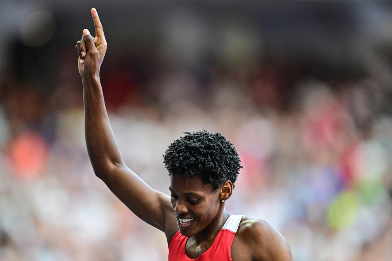 Dominican Republic's Marileidy Paulino celebrates after winning the women's 400m final of the athletics event at the Paris 2024 Olympic Games at Stade de France in Saint-Denis, north of Paris, on August 9, 2024. (Photo by Martin  BERNETTI / AFP)