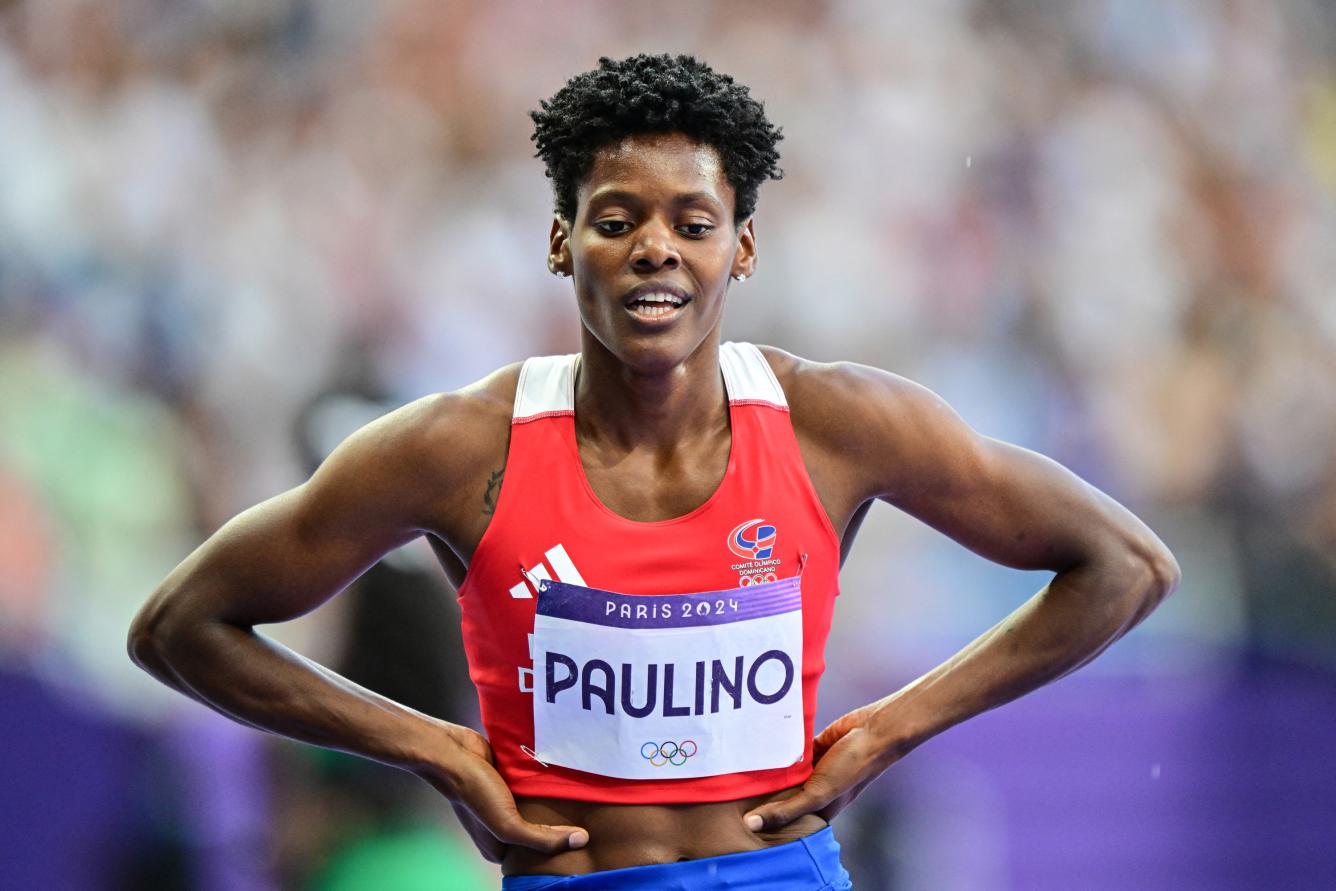 Dominican Republic's Marileidy Paulino celebrates after winning the women's 400m final of the athletics event at the Paris 2024 Olympic Games at Stade de France in Saint-Denis, north of Paris, on August 9, 2024. (Photo by Martin  BERNETTI / AFP)