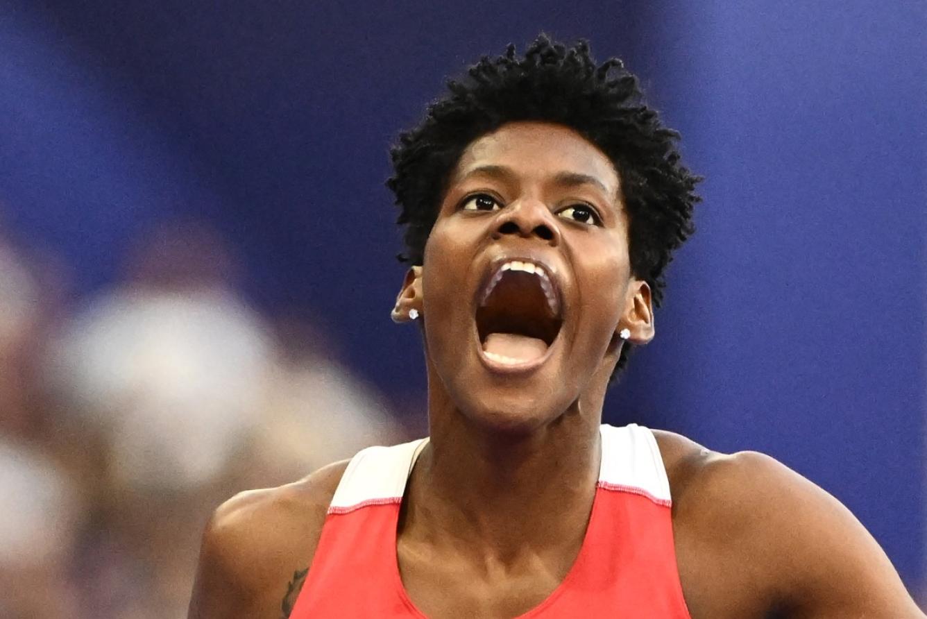 Dominican Republic's Marileidy Paulino celebrates after winning the women's 400m final of the athletics event at the Paris 2024 Olympic Games at Stade de France in Saint-Denis, north of Paris, on August 9, 2024. (Photo by Jewel SAMAD / AFP)