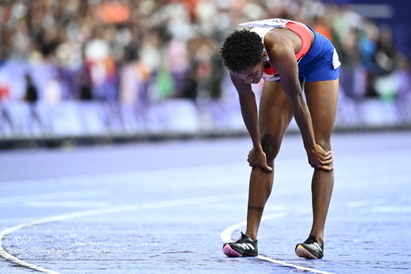 Dominican Republic's Marileidy Paulino reacts after winning the women's 400m final of the athletics event at the Paris 2024 Olympic Games at Stade de France in Saint-Denis, north of Paris, on August 9, 2024. (Photo by Jewel SAMAD / AFP)