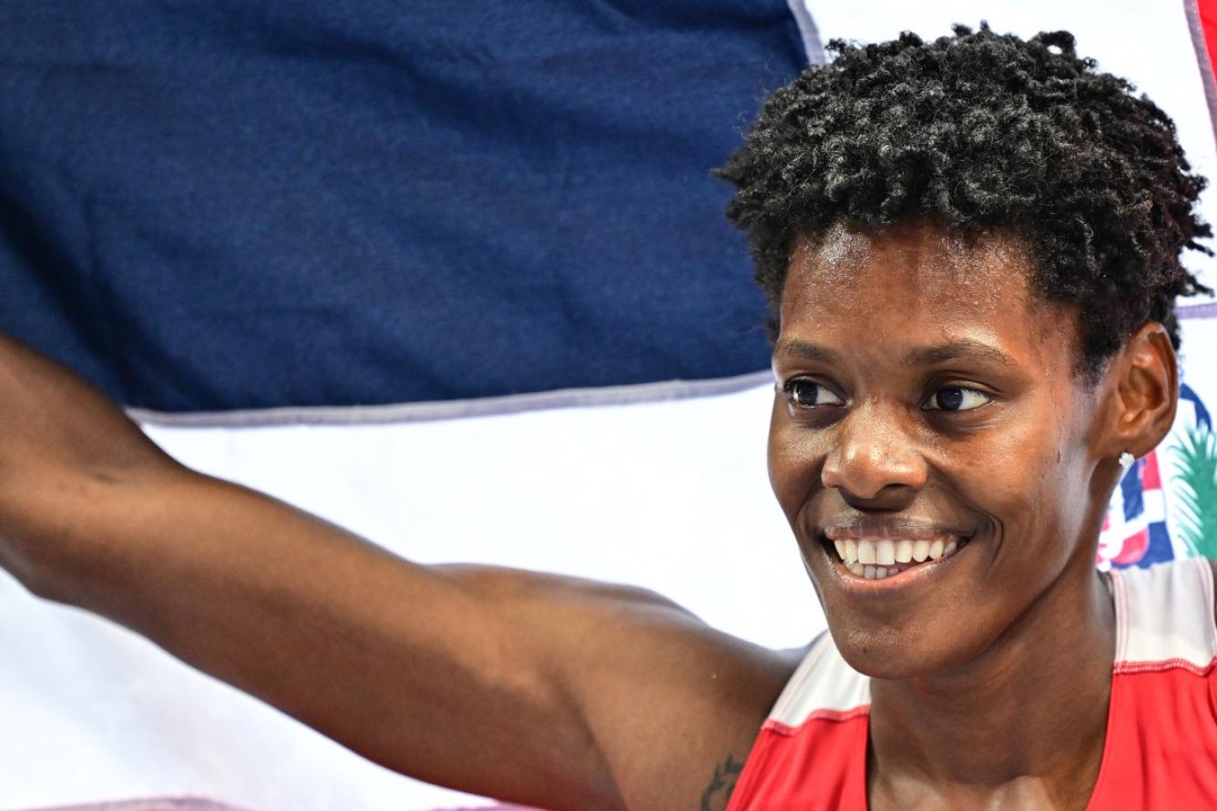 Dominican Republic's Marileidy Paulino celebrates after winning the women's 400m final of the athletics event at the Paris 2024 Olympic Games at Stade de France in Saint-Denis, north of Paris, on August 9, 2024. (Photo by Martin  BERNETTI / AFP)