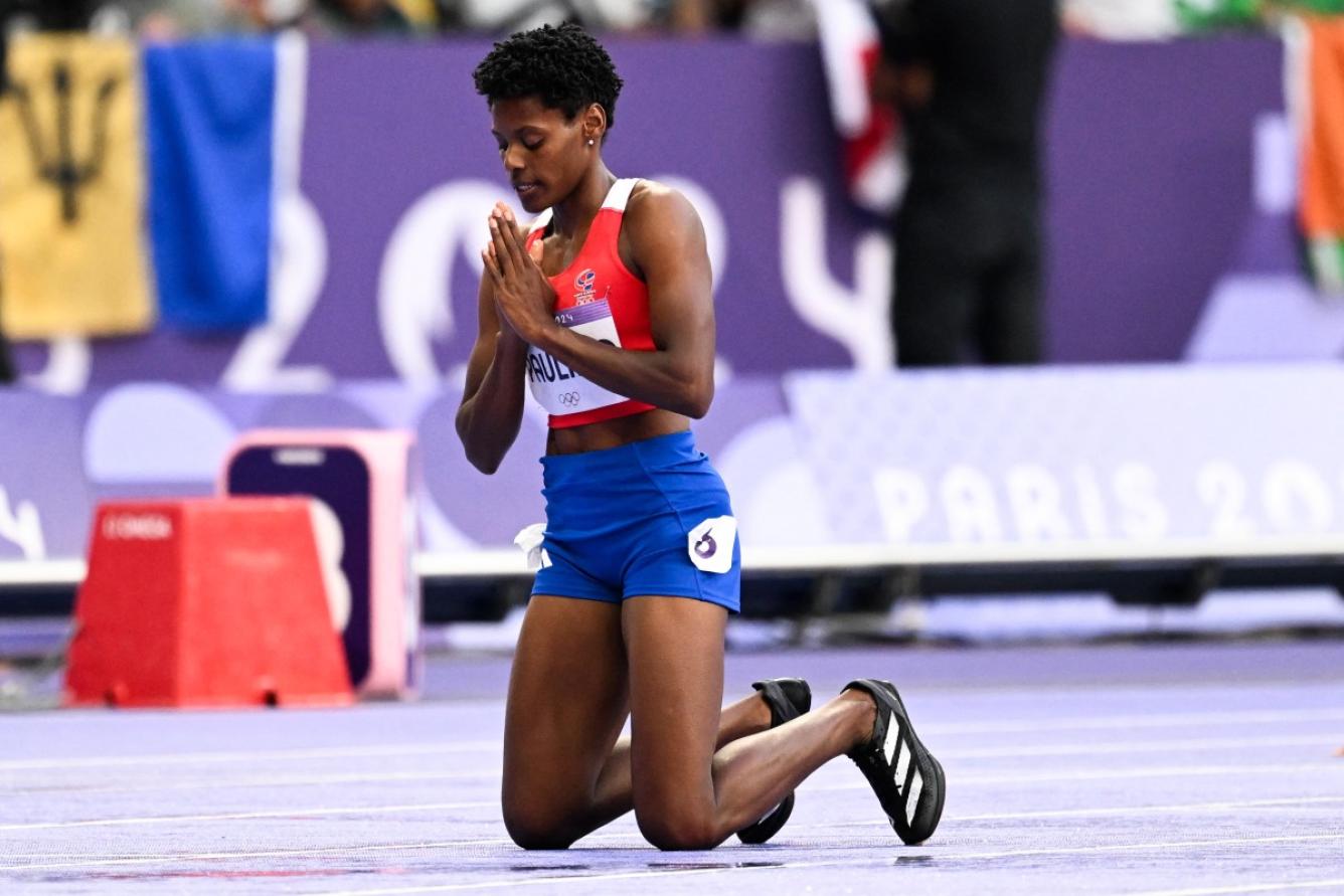 Dominican Republic's Marileidy Paulino celebrates after winning the women's 400m final of the athletics event at the Paris 2024 Olympic Games at Stade de France in Saint-Denis, north of Paris, on August 9, 2024. (Photo by Kirill KUDRYAVTSEV / AFP)