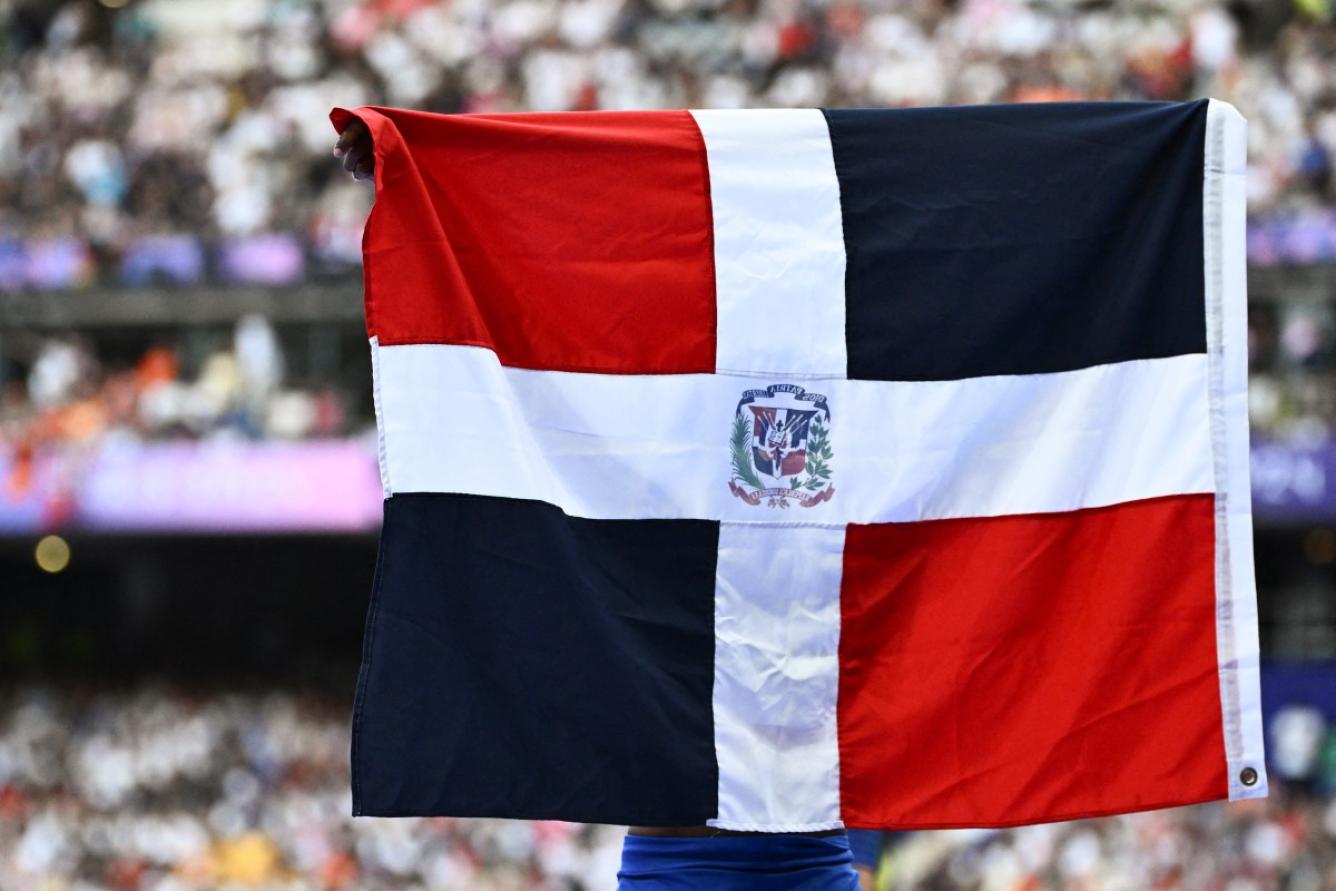 Dominican Republic's Marileidy Paulino celebrates winning the women's 400m final of the athletics event at the Paris 2024 Olympic Games at Stade de France in Saint-Denis, north of Paris, on August 9, 2024. (Photo by Jewel SAMAD / AFP)