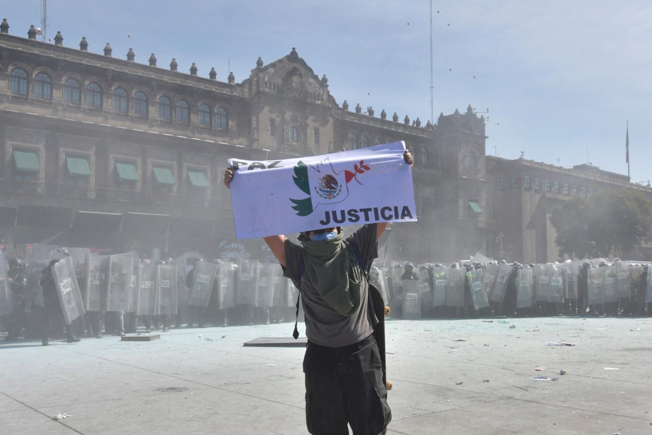 Riot police officers clash with demonstrators during a rally against the government of Mexico's President Claudia Sheinbaum at Zocalo Square in Mexico City on November 15, 2025. (Photo by Alfredo ESTRELLA / AFP)