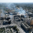 Una vista aérea muestra edificios destruidos en la ciudad de al-Zahra, al sur de la ciudad de Gaza, el 20 de octubre de 2023 tras los bombardeos israelíes de la noche en medio de los combates en curso entre Israel y el grupo palestino Hamás.