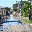 Una calle del Gran Santo Domingo incomunicada por las lluvias