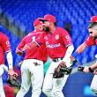 Jugadores de los Tigres del Licey de República Dominicana festejan luego de lograr la victoria frente a Curazao.