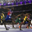 El estadounidense Noah Lyles, segundo desde la izquierda, celebra su victoria en la final masculina de los 100 metros, por delante de Kishane Thompson, de Jamaica.