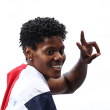 Dominican Republic's Marileidy Paulino celebrates after winning the women's 400m final of the athletics event at the Paris 2024 Olympic Games at Stade de France in Saint-Denis, north of Paris, on August 9, 2024. (Photo by Anne-Christine POUJOULAT / AFP)