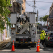 Trabajadores de electricidad realizan reparaciones en la comunidad de Puerta de Tierra tras el paso de la tormenta tropical Ernesto en San Juan.