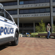 A man walks past the Springfield City Hall after bomb threats were made against buildings earlier in the day in Springfield, Ohio on September 12, 2024. - A government building and school were evacuated after an alleged bomb threat Thursday in Springfield, Ohio, local media reported, rattling the small city at the heart of an anti-migrant conspiracy theory amplified by Donald Trump. Springfield has been thrust into the spotlight in recent days after an unfounded story of Haitian migrants eating pets went viral on social media, with the Republican ex-president and current White House candidate pushing the narrative despite it being debunked. (Photo by ROBERTO SCHMIDT / AFP)