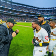 Jugadores de las Águilas celebran luego de dejar en el terreno al Licey.