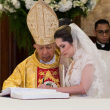 Monseñor de La Rosa y Alexandra Grullón.