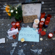 A memorial with candles and a goodbye to Maricarmen Abascal, the 87-year-old pensioner whose eviction triggered nationwide protests over Spain's chronic housing crisis and a political debate that culminated in early elections, is seen at the Puerta del Sol square in Madrid on October 8, 2026. Maricarmen Abascal, who became a symbol of Spain's housing market on September 23 when she was evicted from her life-long Madrid home on a stretcher after the real estate firm that owned the apartment drastically hiked the rent, died in hospital on October 7, 2026. (Photo by Oscar DEL POZO / AFP)