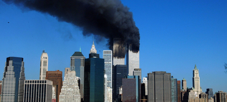 (FILES) The twin towers of the World Trade Center billow smoke after hijacked airliners crashed into them early on September 11, 2001. September 11, 2026, will mark the 25th anniversary of the September 11, 2001, attacks that killed nearly 3,000 people in New York, Washington and Pennsylvania. (Photo by HENNY RAY ABRAMS / AFP)