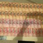 Policía ocupa 24,000 pesos sustraídos por menores de edad en tienda china de Villa Isabela