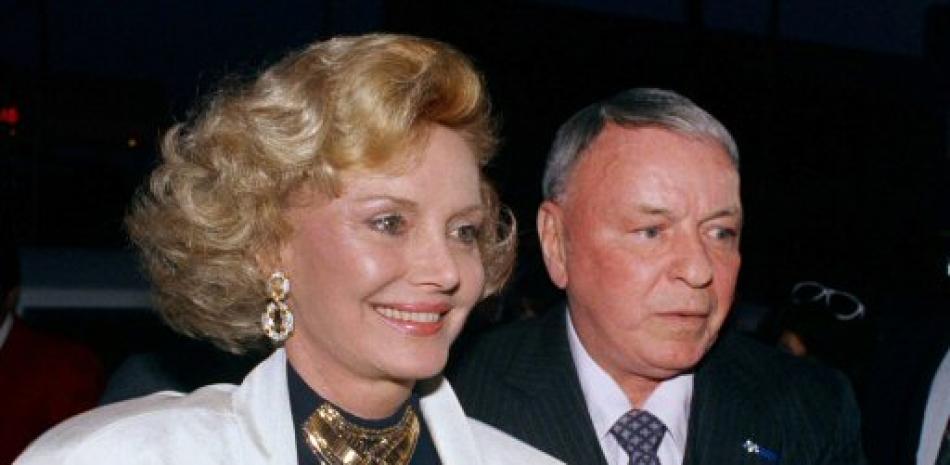 FILE - In this July 12, 1988 file photo Frank Sinatra and his wife Barbara appear at Milton Berle's 80th birthday party in Los Angeles. Barbara Sinatra, a prominent advocate and philanthropist for abused children, died Tuesday, July 25, 2017, of natural causes at her Rancho Mirage, California, home. She was 90. (AP Photo/File)