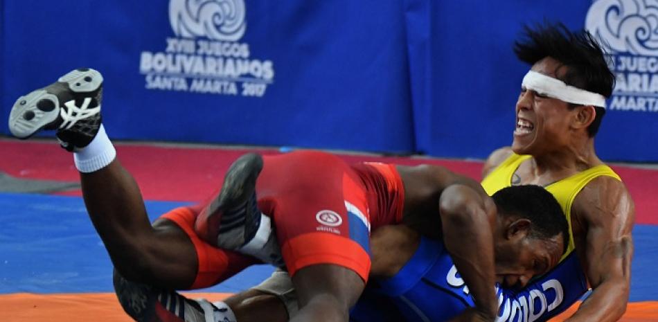 El dominicano Juan Rubelín Ramírez Beltré ganador de la medalla de oro en la categoría de los 57 kilogramos del torneo de lucha, estilo libre.