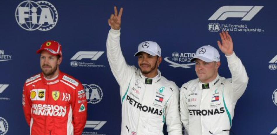 Lewis Hamilton, Valteri Bottas y Sebastian vettel figuran en el podium de ganadores en la Pole posición del Gran Premio de Brasil.