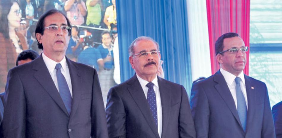 Gustavo Montalvo, Danilo Medina y Andrés Navarro.