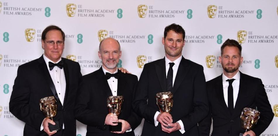 Dan Sudick, Craig Hammack, Geoffrey Baumann, y Jesse James Chisholm, ganadores del premio por mejores efectos especiales por la película Black Panther. AFP.