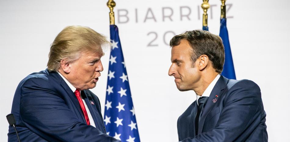 Donald Trump y Enmanuel Macron, AFP