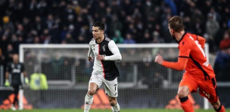 Cristiano Ronaldo corre con el balón durante el partido de fútbol de la Serie A italiana Juventus vs Udinese. Isabella Bonotto/AFP.