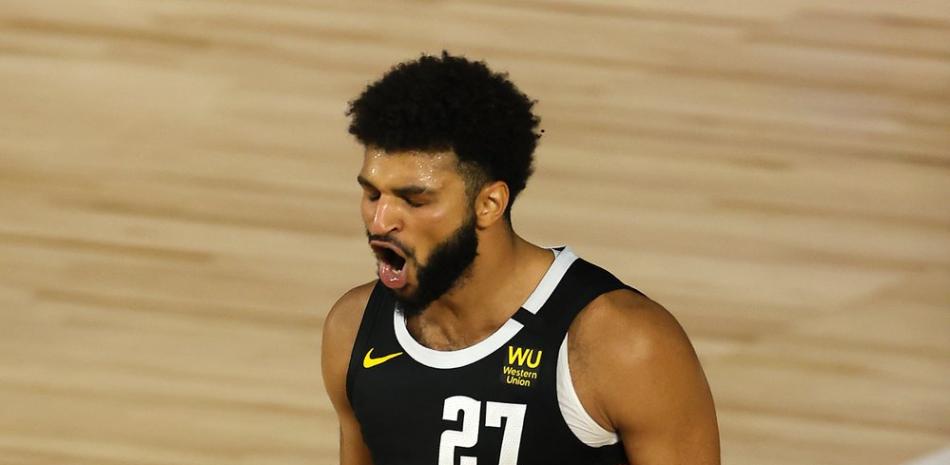 Jamal Murray, de los Denver Nuggets, reacciona después de un disparo durante la segunda mitad del Juego 5 de una serie de playoffs de primera ronda de baloncesto de la NBA, el martes 25 de agosto de 2020, en Lake Buena Vista, Florida.