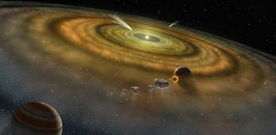 Concepción artística del polvo y el gas que rodean un sistema planetario recién formado. - NASA