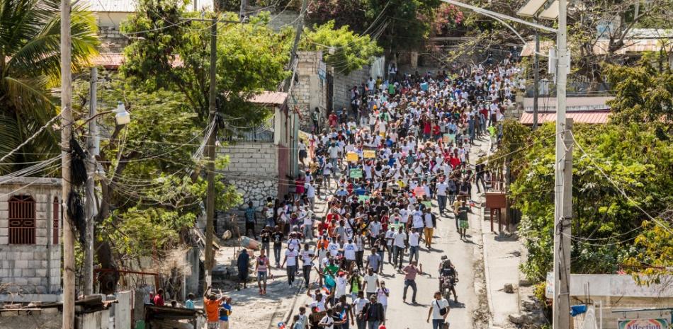 Los manifestantes marchan en Puerto Príncipe el 14 de febrero de 2021 para protestar contra el gobierno del presidente Jovenel Moise.
Valerie Baeriswyl / AFP