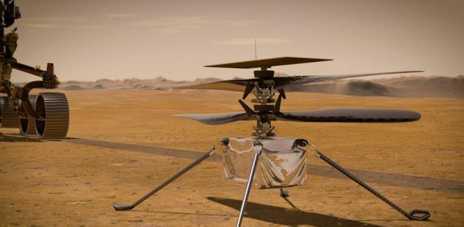 Esta ilustración facilitada por la NASA muestra el helicóptero Ingenuity Mars en la superficie del planeta rojo cerca del rover Perseverance, a la izquierda.

Foto: NASA / JPL-Caltech vía AP
