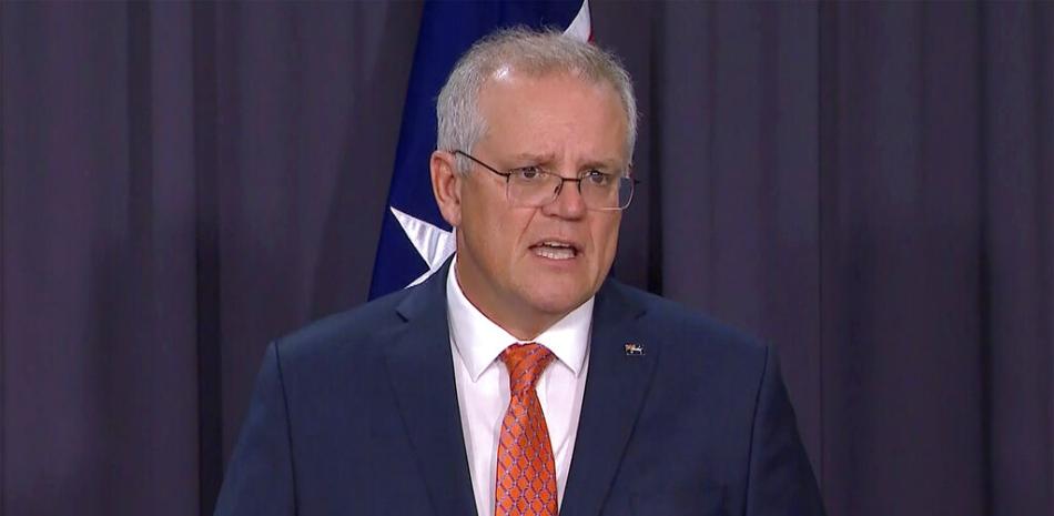 En esta imagen tomada de un video, el primer ministro australiano Scott Morrison habla en una conferencia de prensa en Canberra el jueves, 8 de abril del 2021.

Foto: SBS vía AP