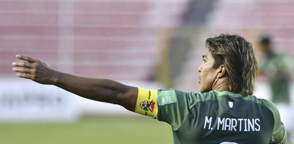 Marcelo Martins, de Bolivia, celebra tras marcar un gol en acción del partido frente a Venezuela en las eliminatorias sudamericanas para el Mundial de Fútbol.