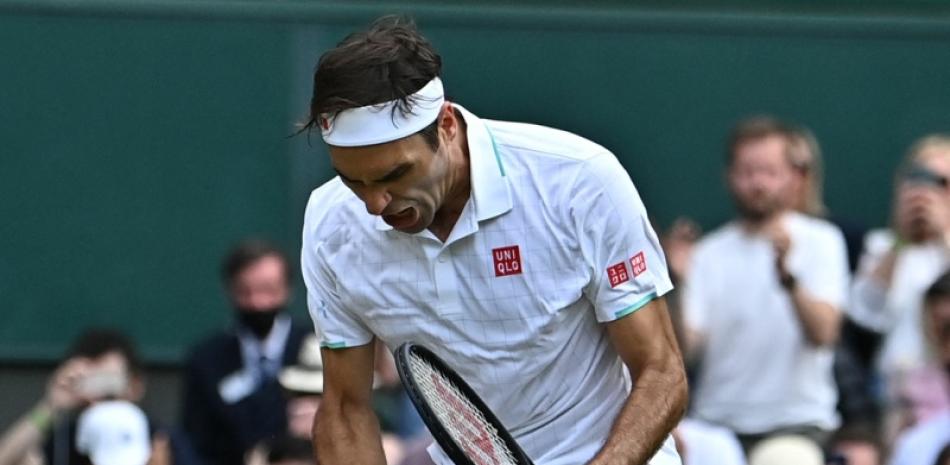 Roger Federer hace un gesto de emoción tras cristalizar su victoria ante Camaron Norris.