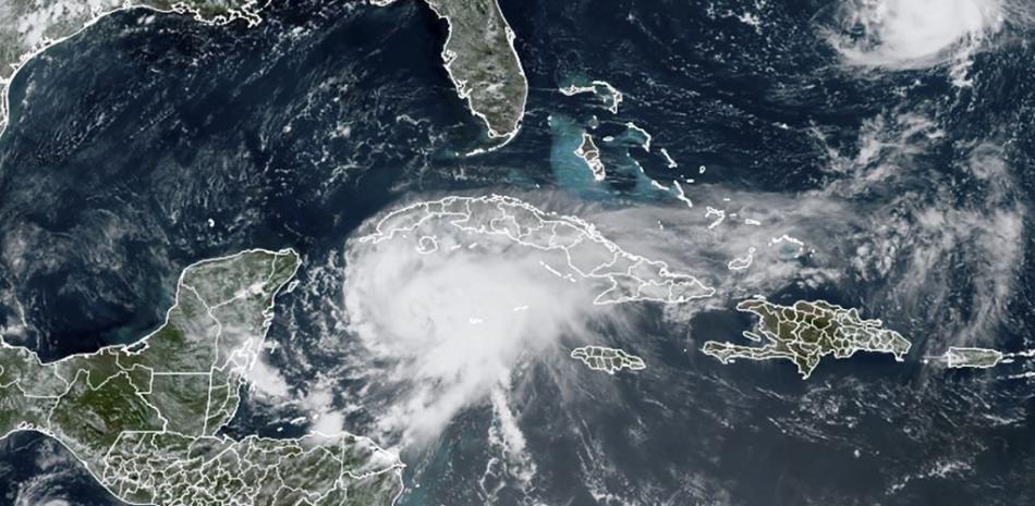 Esta imagen satelital de la RAMMB de la Administración Nacional Oceánica y Atmosférica (NOAA) muestra a la tormenta tropical Grace avanzando hacia la costa de México a las 17:30 UTC del 18 de agosto de 2021 en el Caribe.

Foto: Folleto / RAMMB / NOAA / NESDIS / AFP