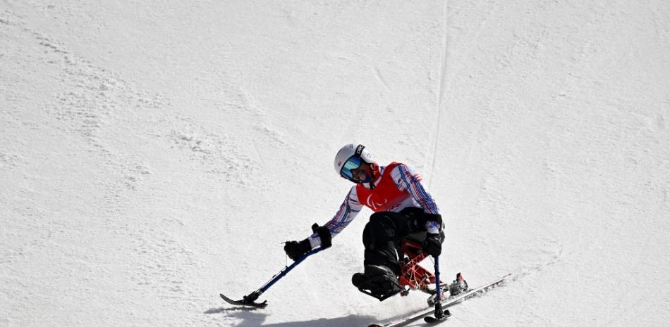 Orlando Pérez de Puerto Rico reacciona después de competir en la competencia de esquí para alpino sentado de slalom gigante masculino en el Centro Nacional de Esquí Alpino de Yanqing en Yanqing durante los Juegos Paralímpicos de Invierno de Beijing 2022 el 10 de marzo de 2022.
WANG Zhao / AFP