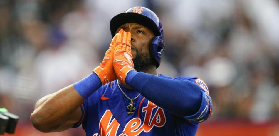 Starling Marte, de los Mets, reacciona al llegar al plato tras conectar un cuadrangular en el partido frente a los Yanquis en el béisbol de las Grandes Ligas.