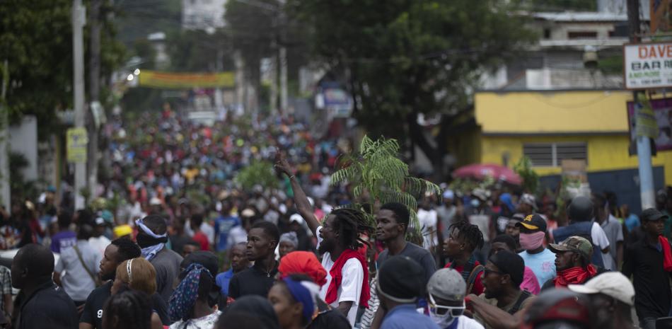 Miles de manifestantes haitianos exigen la dimisión de Henry, Foto: AP