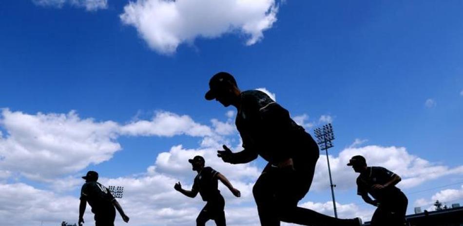 Peloteros de Ligas Menores durante una práctica. Foto: AP.