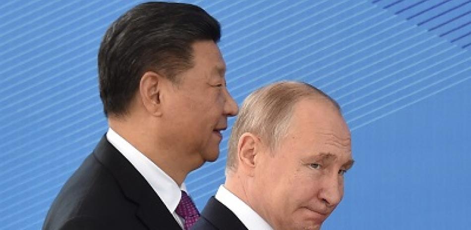 Vladímir Putin junto a Xi Jinping. Foto: AF.