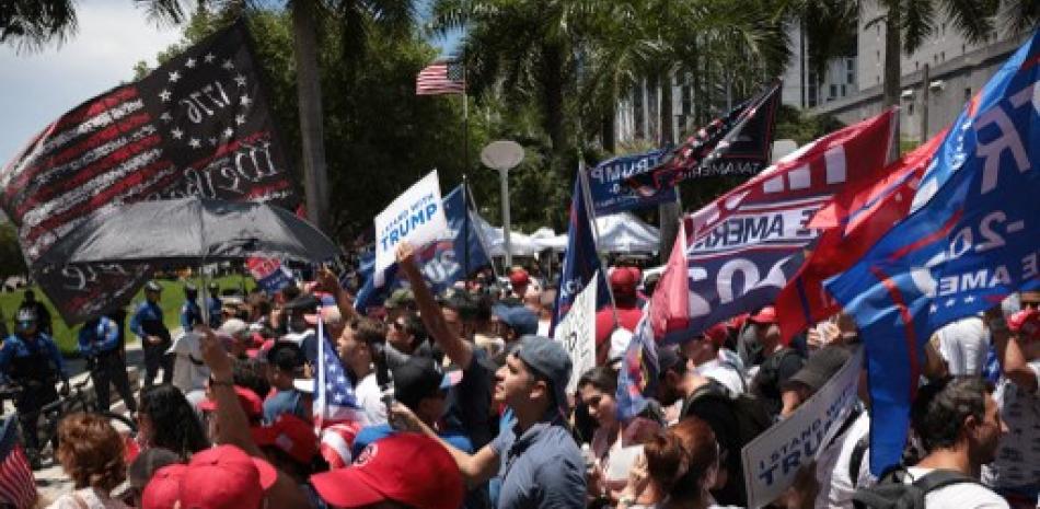 MIAMI, FLORIDA - JUNE 13: Trump supporters gather outside the Wilkie D. Ferguson Jr. United States Federal Courthouse as former President Donald Trump appears for his arraignment on June 13, 2023 in Miami, Florida. Trump is scheduled to appear in the federal court for his arraignment on charges including possession of national security documents after leaving office, obstruction, and making false statements.   Win McNamee/Getty Images/AFP (Photo by WIN MCNAMEE / GETTY IMAGES NORTH AMERICA / Getty Images via AFP)