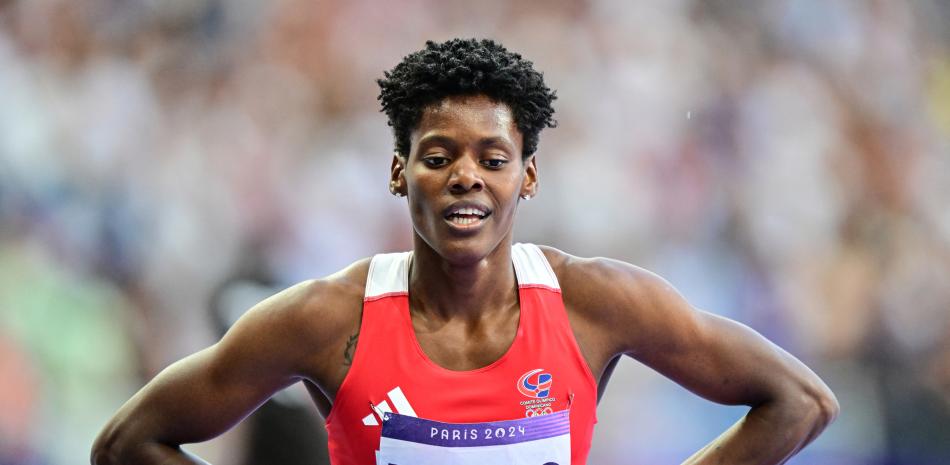 Dominican Republic's Marileidy Paulino celebrates after winning the women's 400m final of the athletics event at the Paris 2024 Olympic Games at Stade de France in Saint-Denis, north of Paris, on August 9, 2024. (Photo by Martin  BERNETTI / AFP)