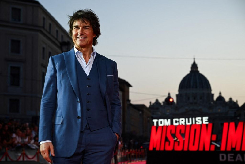 US producer and actor Tom Cruise poses during the premiere of "Mission: Impossible - Dead Reckoning Part One" movie with St. Peter's dome in the back, at Auditorium della Conciliazione in Rome, on June 19, 2023. (Photo by Filippo MONTEFORTE / AFP)