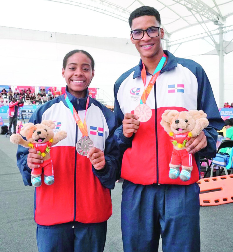 Karla Ramos y Yoan Sánchez, quienes lograron preseas en su participación en los Juegos Bolivarianos.